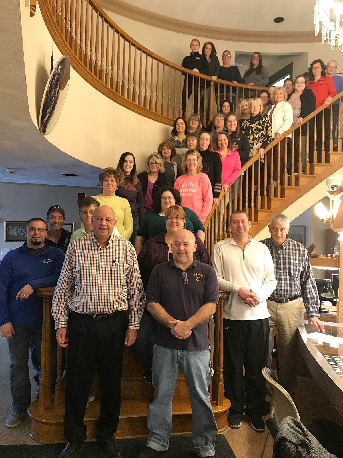 David Hendrickson Retirement - Photo on History Stairs in the SilverTowne Showroom with Some Employees