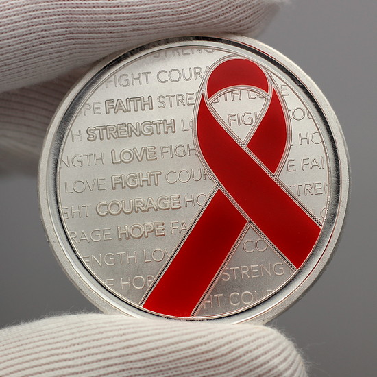 Enameled Red Awareness Ribbon Silver Round Hand Photo Showing Reflective Qualities